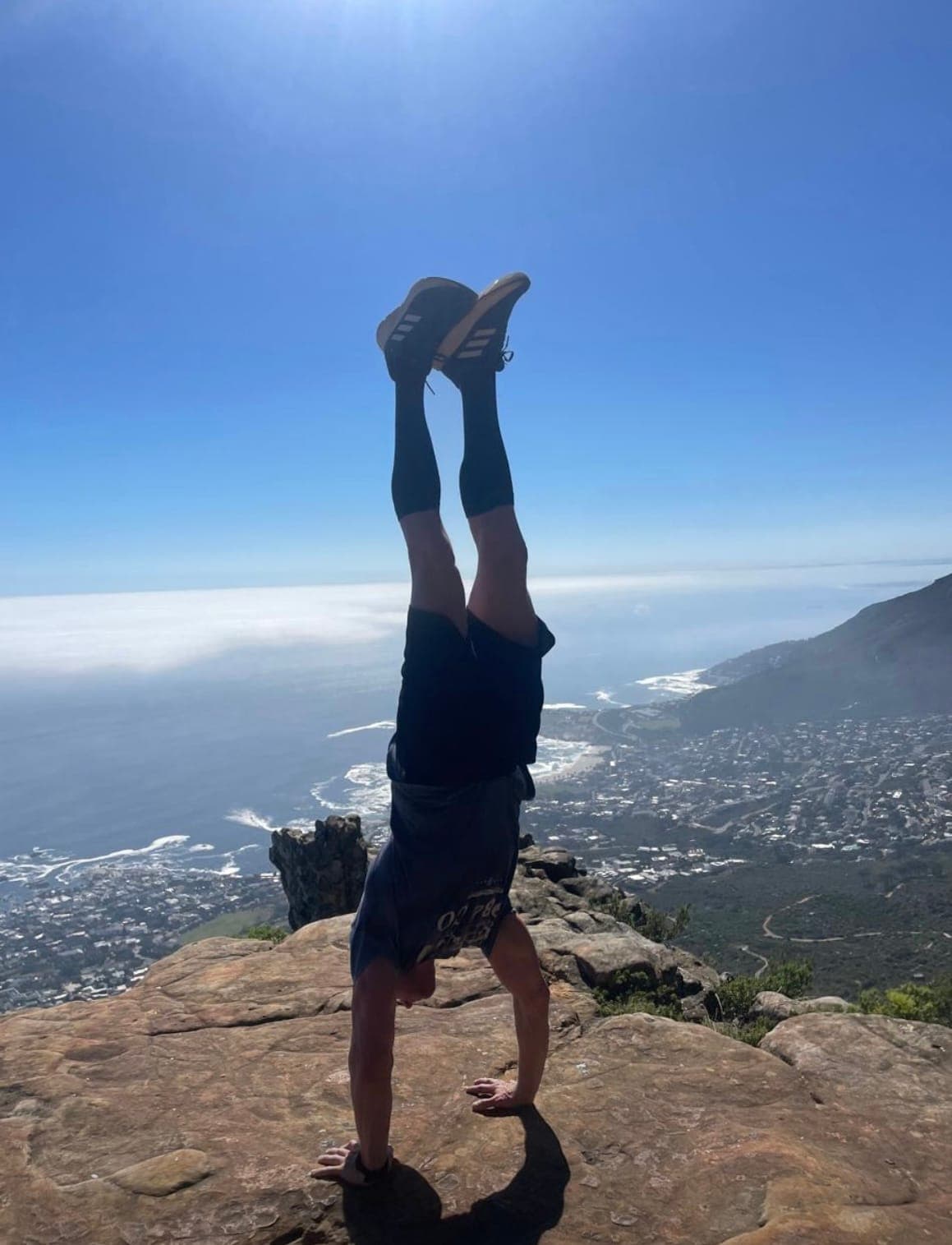 David doing a handstand on Lion's Head